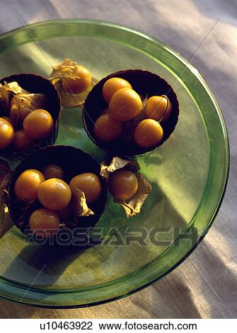 Oriental fruit in green glass powl. View Large Photo Image Stock Image - Oriental fruit in green glass powl.. Fotosearch