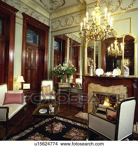 Stock Photo Of Ornate Chandelier And Gilt Cornice In Traditional Ornate Chandelier And Gilt Cornice In Traditional Living Room