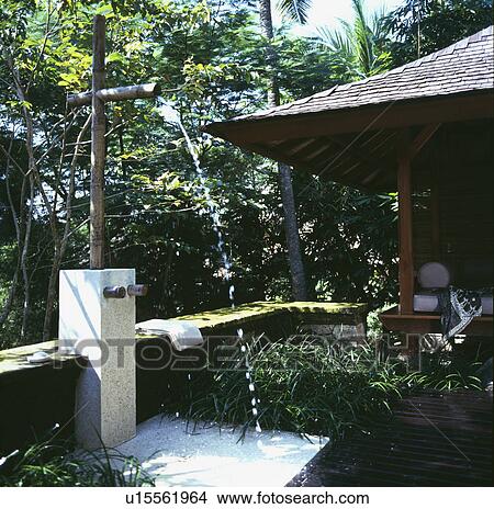 Outdoor shower in oriental-style garden View Large Photo Image Picture - Outdoor shower in oriental-style garden. Fotosearch