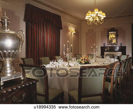 Oval table with white cloth in hotel dining room View Large Photo Image Stock Photography - Oval table with white cloth in hotel dining room . Fotosearch