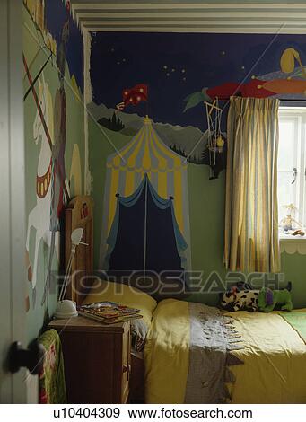 Paint effect mural on wall of child's bedroom with yellow bedlinen View Large Photo Image Stock Photo - Paint effect mural on wall of child's bedroom with yellow bedlinen. Fotosearch