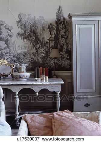 Stock Photo - Painted 18th-century mural on wall above grey table. Fotosearch