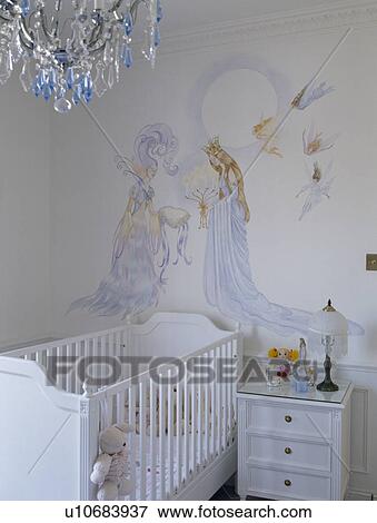 Stock Photo - Painted Sleeping Beauty mural on wall above baby's cot in child's nursery bedroom. Fotosearch