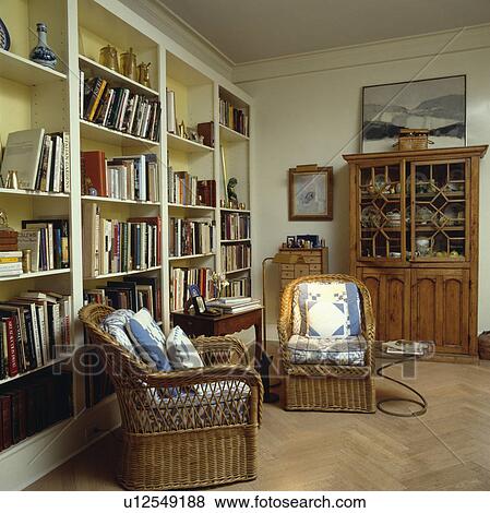 Stock Photo - Parquet floor in traditional living room with wicker armchairs . Fotosearch