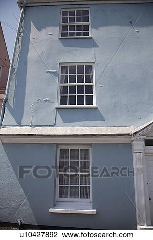 Pastel blue Georgian house with white window frames View Large Photo Image Stock Image - Pastel blue Georgian house with white window frames. Fotosearch