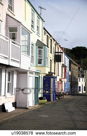Pastel terraced houses on street in Cornish seaside village View Large Photo Image Stock Photo - Pastel terraced houses on street in Cornish seaside village. Fotosearch