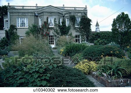 Path through borders in front of large country house View Large Photo Image Stock Image - Path through borders in front of large country house. Fotosearch