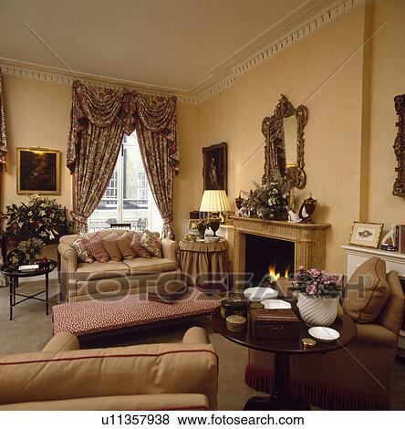 Stock Photo - Patterned curtains in traditional living room. Fotosearch
