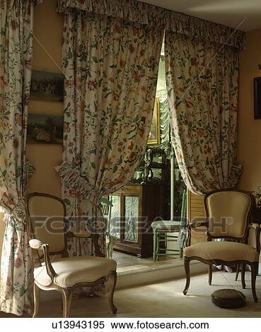 Patterned curtains in traditional living room View Large Photo Image Stock Photography - Patterned curtains in traditional living room. Fotosearch