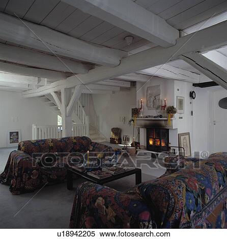 Patterned sofas in eighties living room with white painted beamed ceiling View Large Photo Image Stock Photography - Patterned sofas in eighties living room with white painted beamed ceiling. Fotosearch