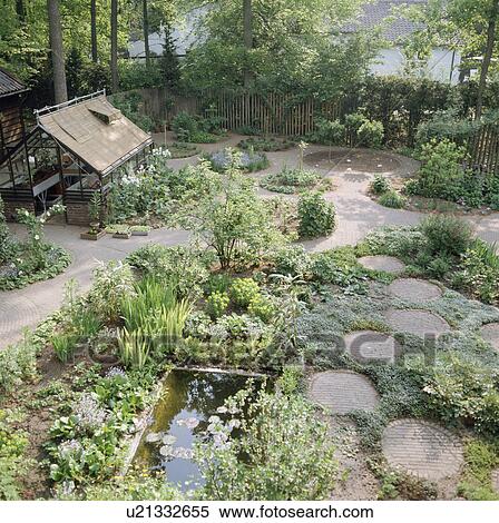 Paved circles and rectangular pond in enclosed country garden View Large Photo Image Stock Photography - Paved circles and rectangular pond in enclosed country garden. Fotosearch