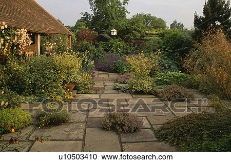 Paving in garden of small house in summer View Large Photo Image Stock Image - Paving in garden of small house in summer. Fotosearch