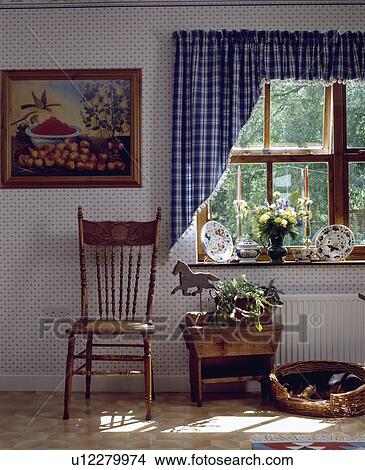 Picture above stickback chair in front of window with blue+white checked curtains in hall with spotted wallpaper View Large Photo Image Picture - Picture above stickback chair in front of window with blue+white checked curtains in hall with spotted wallpaper. Fotosearch