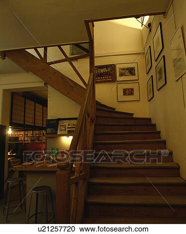 Pictures above wooden staircase in openplan hall View Large Photo Image Stock Image - Pictures above wooden staircase in openplan hall . Fotosearch