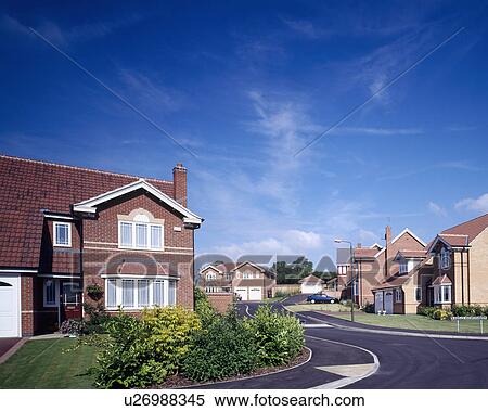 Red brick newbuild house on small housing estate View Large Photo Image Stock Photography - Red brick newbuild house on small housing estate . Fotosearch