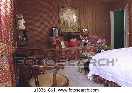 Red sofa and antique chair in terracotta bedroom View Large Photo Image Stock Image - Red sofa and antique chair in terracotta bedroom. Fotosearch