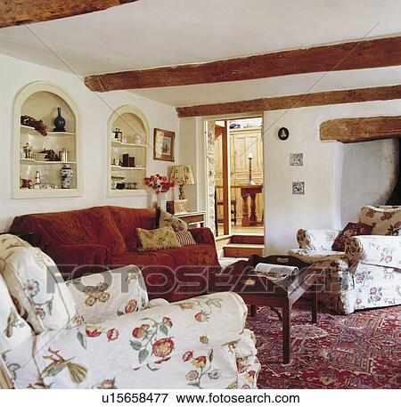 Red sofa in cottage living room with patterned carpet View Large Photo Image Stock Photo - Red sofa in cottage living room with patterned carpet. Fotosearch