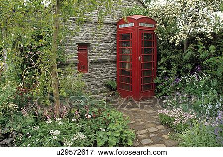 Red telephone box in Spring garden View Large Photo Image Stock Photo - Red telephone box in Spring garden. Fotosearch