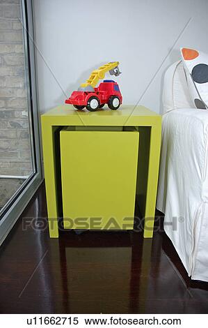 Red toy truck on lime green table with large pull out storage drawer View Large Photo Image Stock Photography - Red toy truck on lime green table with large pull out storage drawer. Fotosearch