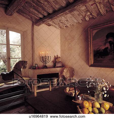 Rockinghorse In Rustic Dining Room With Textured Walls And