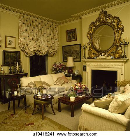 Ruched blind in traditional yellow town living room View Large Photo Image Stock Image - Ruched blind in traditional yellow town living room. Fotosearch