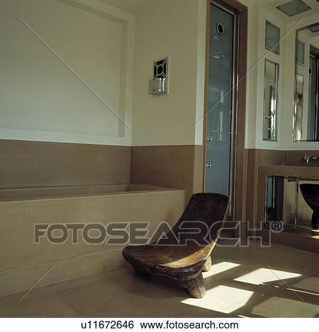 Stock Photograph - Rustic wooden seat in modern bathroom . Fotosearch