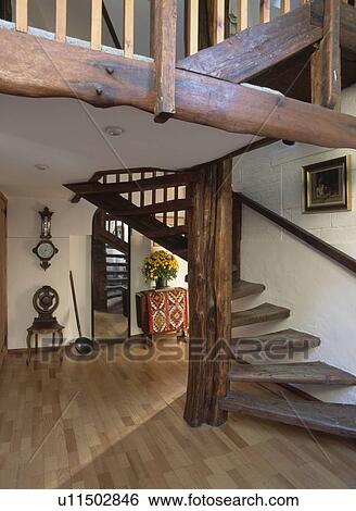 Rustic wooden staircase in traditional country hall with wooden flooring View Large Photo Image Stock Photograph - Rustic wooden staircase in traditional country hall with wooden flooring. Fotosearch