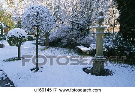 Sculpture in snow in country garden in winter View Large Photo Image Stock Photo - Sculpture in snow in country garden in winter. Fotosearch