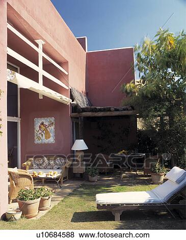 Seating and furniture on patio of Spanish villa View Large Photo Image Stock Photo - Seating and furniture on patio of Spanish villa. Fotosearch