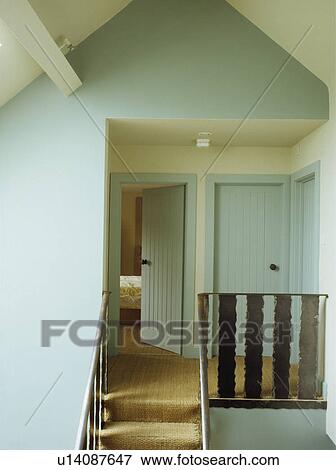 Sisal carpet on pastel turquoise landing in barn conversion  View Large Photo Image Stock Photo - Sisal carpet on pastel turquoise landing in barn conversion . Fotosearch