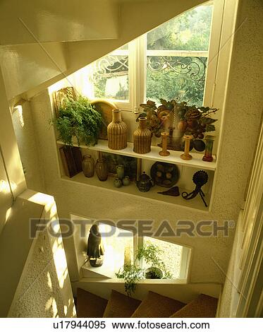 Sisal carpet on staircase below window with wicker bottles on shelves View Large Photo Image Stock Photography - Sisal carpet on staircase below window with wicker bottles on shelves . Fotosearch