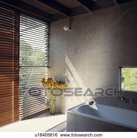 Slatted wooden blinds on large windows in modern bathroom with stone walls View Large Photo Image Stock Photograph - Slatted wooden blinds on large windows in modern bathroom with stone walls. Fotosearch