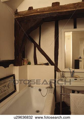 Small traditional beamed white bathroom View Large Photo Image Stock Image - Small traditional beamed white bathroom . Fotosearch