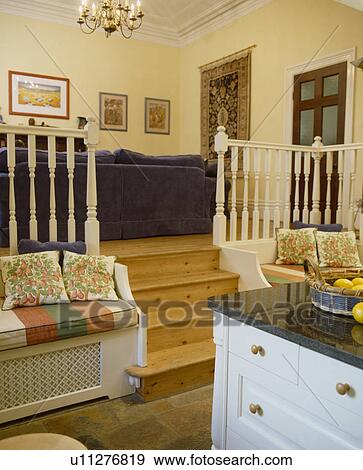 Stock Photo - Split-level kitchen and living room. Fotosearch