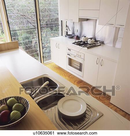 Stainless steel sinks in modern white kitchen View Large Photo Image Stock Image - Stainless steel sinks in modern white kitchen. Fotosearch