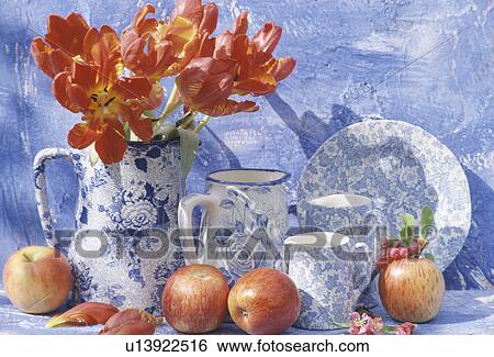 Stock Photograph - Still-Life of red tulips and blue+white jugs. Fotosearch