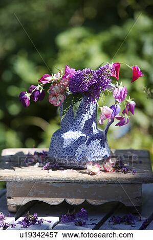 Still-Life of summer flowers in blue jug View Large Photo Image Stock Photo - Still-Life of summer flowers in blue jug. Fotosearch