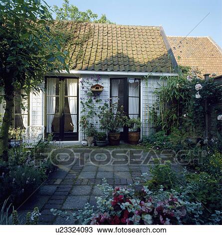 Stone paving in courtyard garden View Large Photo Image Stock Image - Stone paving in courtyard garden. Fotosearch