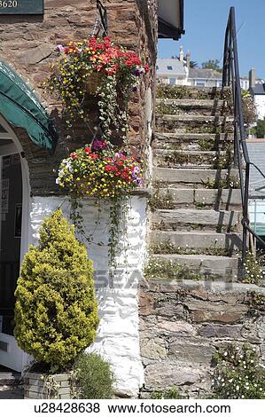 Stone steps with iron handrail beside cottage View Large Photo Image Stock Photo - Stone steps with iron handrail beside cottage. Fotosearch