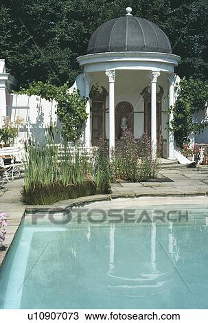 Swimming pool and classical gazebo in large country garden View Large Photo Image Stock Image - Swimming pool and classical gazebo in large country garden. Fotosearch
