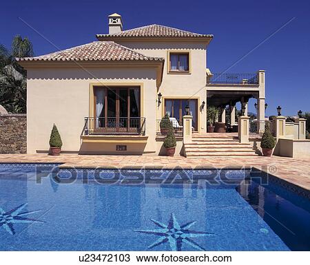 Swimming pool in front of large modern villa in Southern Spain View Large Photo Image Stock Image - Swimming pool in front of large modern villa in Southern Spain. Fotosearch