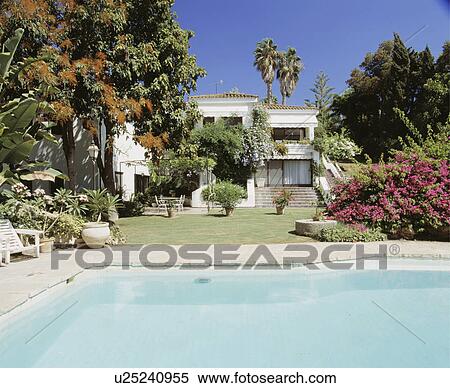 Swimming pool in front of large modern villa in Southern Spain View Large Photo Image Stock Photography - Swimming pool in front of large modern villa in Southern Spain. Fotosearch