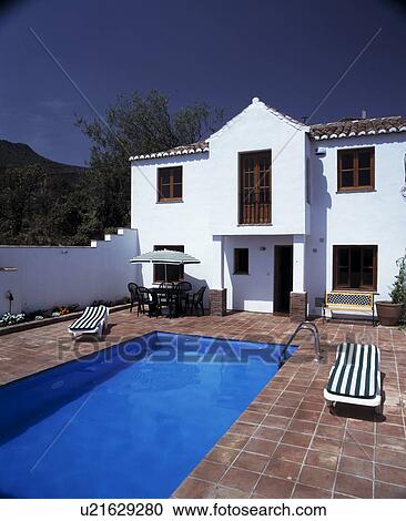 Swimming pool in front of large villa in southern Spain View Large Photo Image Stock Image - Swimming pool in front of large villa in southern Spain. Fotosearch