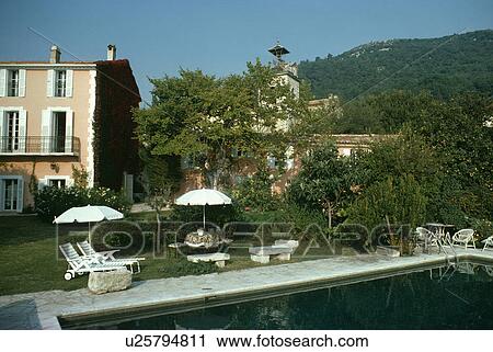 Swimming pool in garden of large house in Provence View Large Photo Image Stock Image - Swimming pool in garden of large house in Provence. Fotosearch