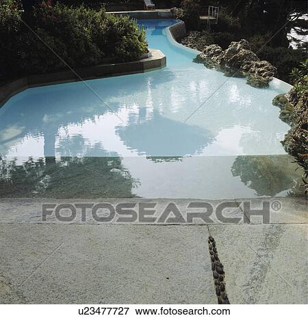 Swimming pool in Italian garden overlooking the sea View Large Photo Image Stock Photo - Swimming pool in Italian garden overlooking the sea. Fotosearch