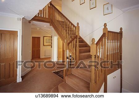 Tan carpet in hall and on wooden staircase View Large Photo Image Picture - Tan carpet in hall and on wooden staircase. Fotosearch