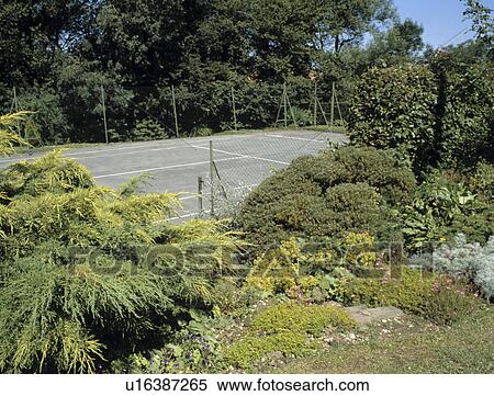 Tennis court in large country garden View Large Photo Image Stock Photography - Tennis court in large country garden. Fotosearch