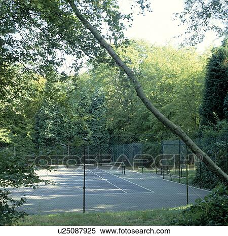 Tennis court in large country garden View Large Photo Image Stock Photography - Tennis court in large country garden. Fotosearch