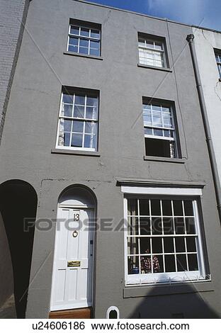 Terraced grey Victorian townhouse with white front door View Large Photo Image Stock Photograph - Terraced grey Victorian townhouse with white front door. Fotosearch