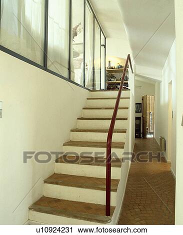 Terracotta tiles on stairs and floor in white hall View Large Photo Image Stock Image - Terracotta tiles on stairs and floor in white hall . Fotosearch